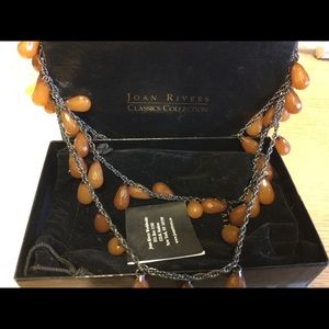 Joan Rivers necklace. One purple and other gold. New. $20 ea